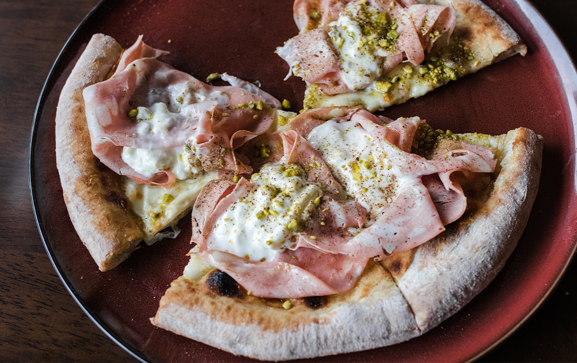 a pizza with slices taken out of it